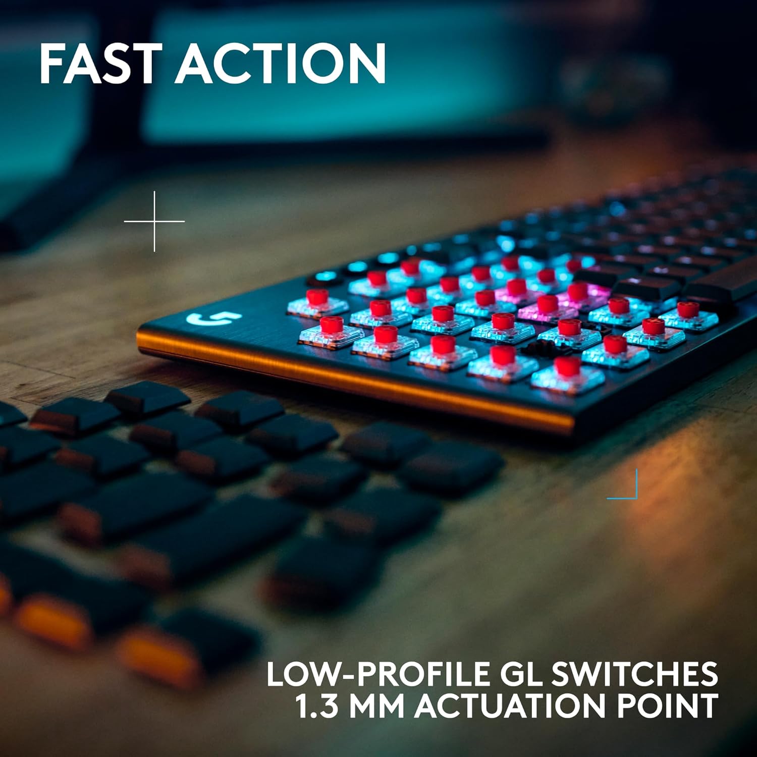 Gaming keyboard with low-profile GL switches on a wooden surface, text 'FAST ACTION' and 'LOW-PROFILE GL SWITCHES 1.3 MM ACTUATION POINT' displayed.