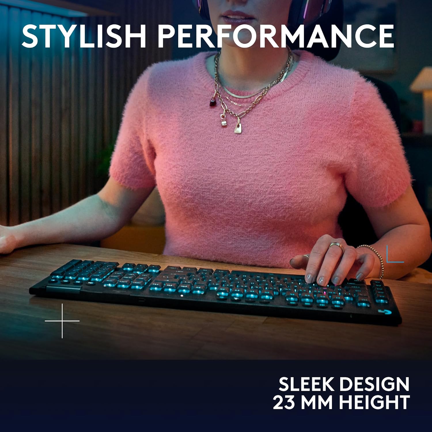 Person using a computer keyboard with text 'Stylish Performance' and 'Sleek Design 23 MM Height'.